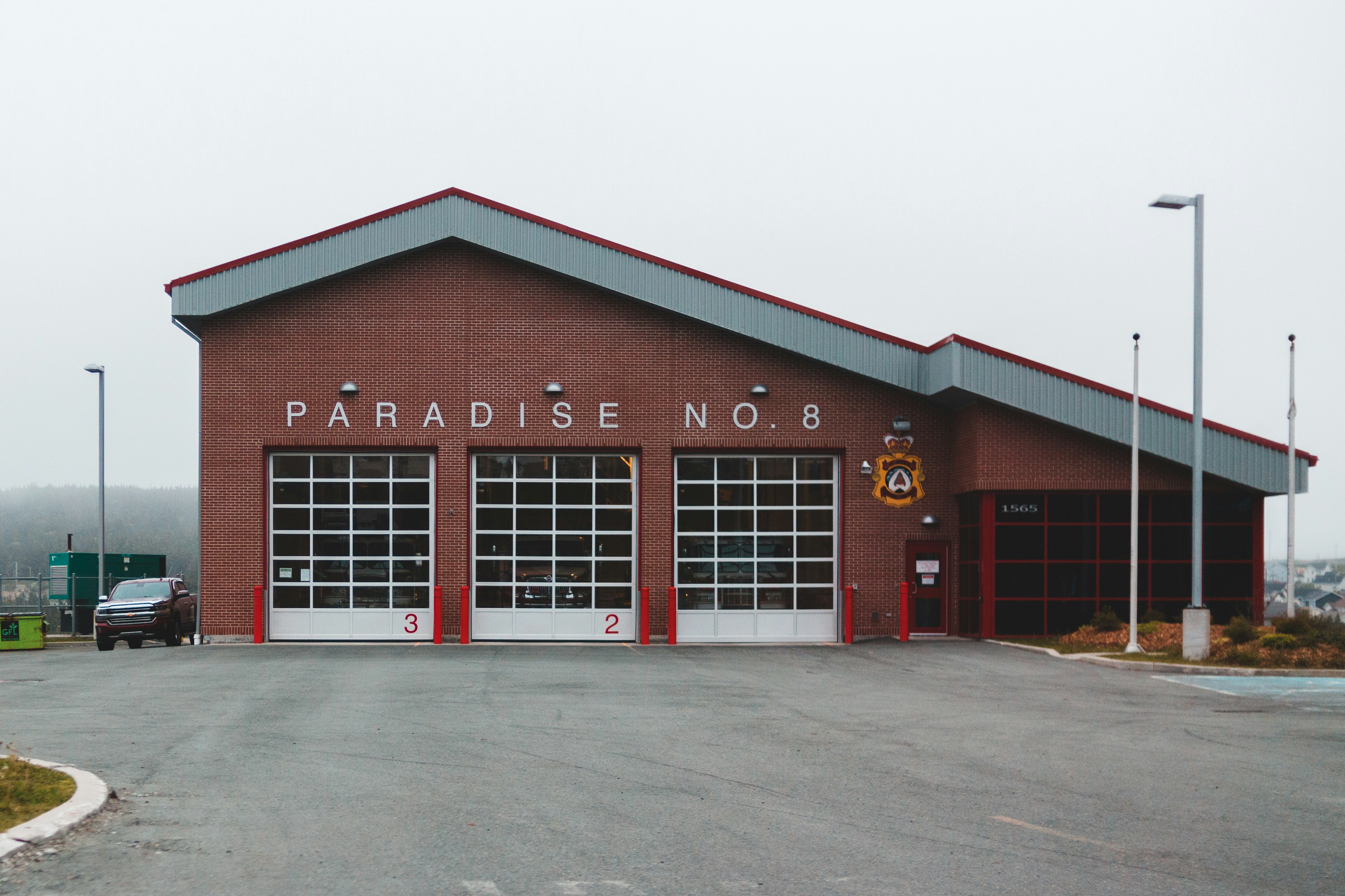 red and white wooden house under gray sky during daytime